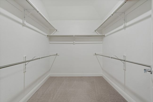 Walk in closet with light carpet | Image 22