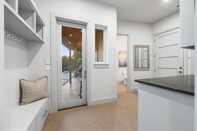 Mudroom featuring light tile patterned floors and baseboards | Image 20