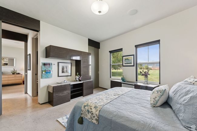 Bedroom featuring dark aggregate flooring | Image 21