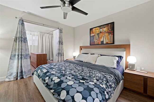 Bedroom featuring wood finished floors and ceiling fan | Image 7