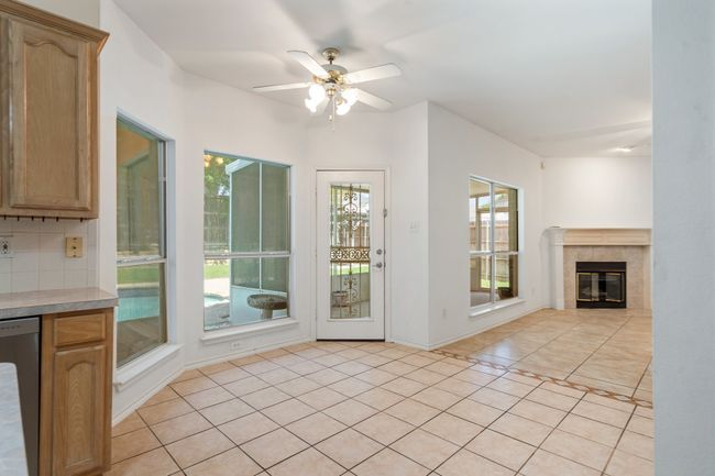 Unfurnished living room with a healthy amount of sunlight, ceiling fan, and light tile patterned floors | Image 18