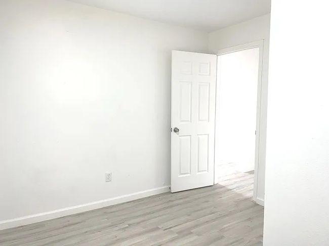 Spare room with light wood finished floors and baseboards | Image 6