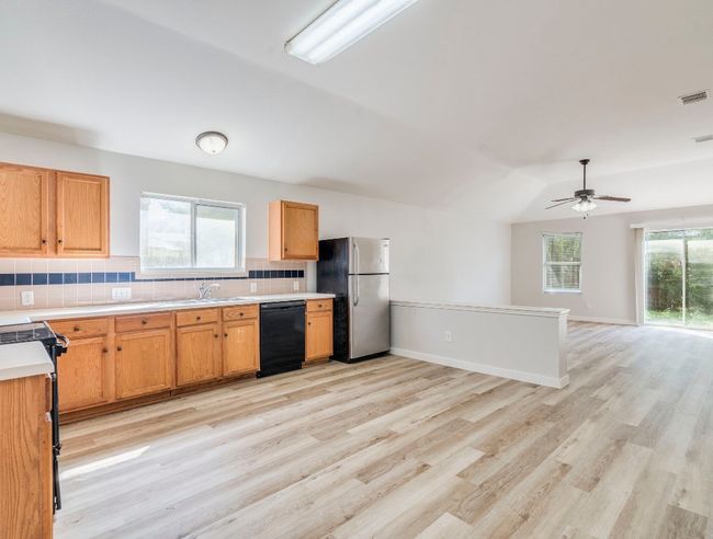 Kitchen with dining area offers flexible arrangements | Image 7