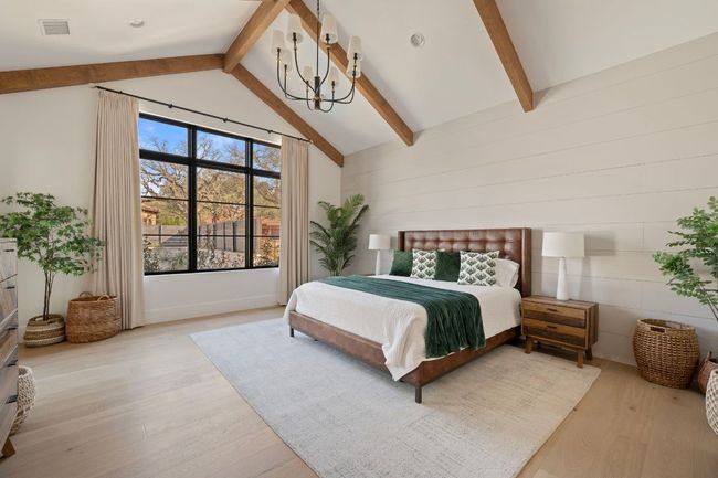 Bedroom with visible vents, beamed ceiling, light wood-style flooring, and an inviting chandelier | Image 15