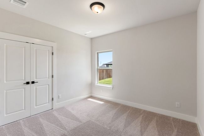 Unfurnished bedroom featuring carpet floors and a closet | Image 19