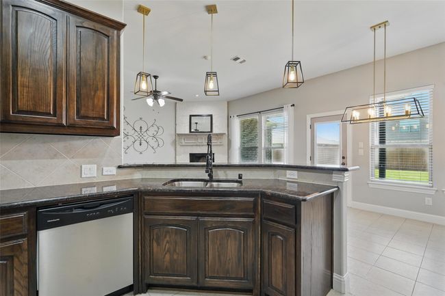Upgraded kitchen faucet and pendent lighting | Image 5