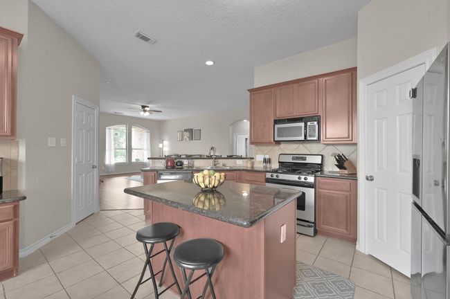 Kitchen w/ 42" cabinets and ample storage include walk-in pantry | Image 6