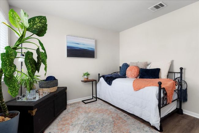 Bedroom featuring baseboards and light wood finished floors | Image 25