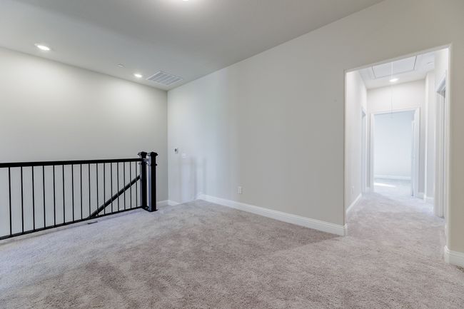 Carpeted empty room with attic access and recessed lighting | Image 15