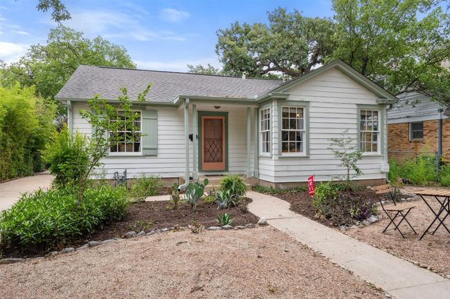 Beautiful front of house with landscaped front yard and tall trees | Image 21