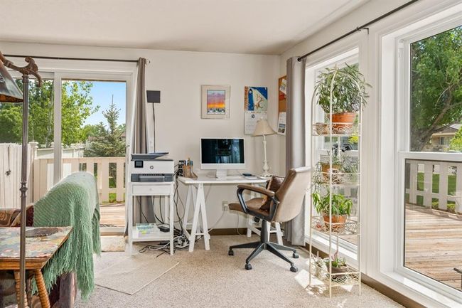Living room from front door to the right. Great view of how bright this area is with windows and sliding glass door | Image 11