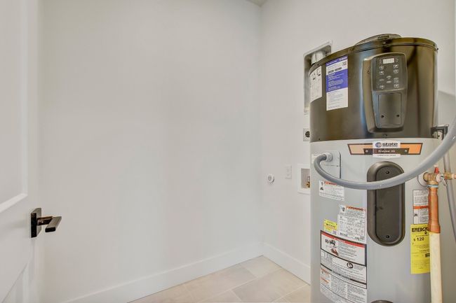 Utility room featuring water heater | Image 25