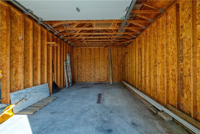 Detached garage is deep with a high ceiling. | Image 30