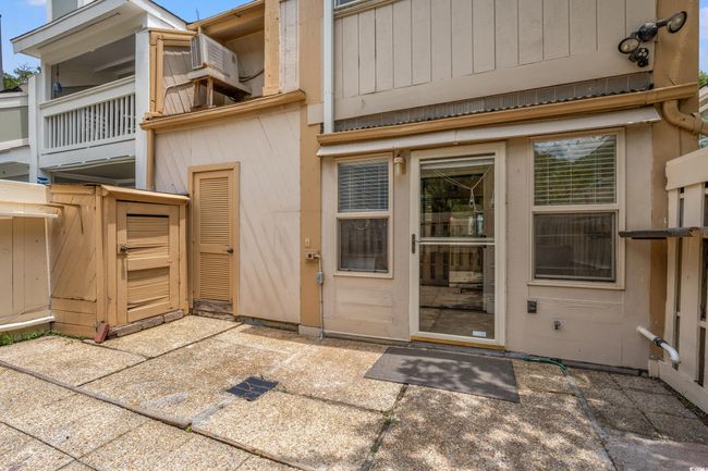 Rear view of house featuring a patio | Image 29