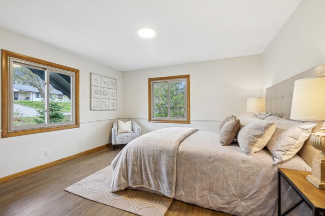 Generously sized primary bedroom. One of the closets is plumbed for a half bath. | Image 10