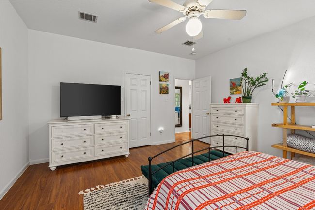 Bedroom featuring dark wood-type flooring and a ceiling fan | Image 19