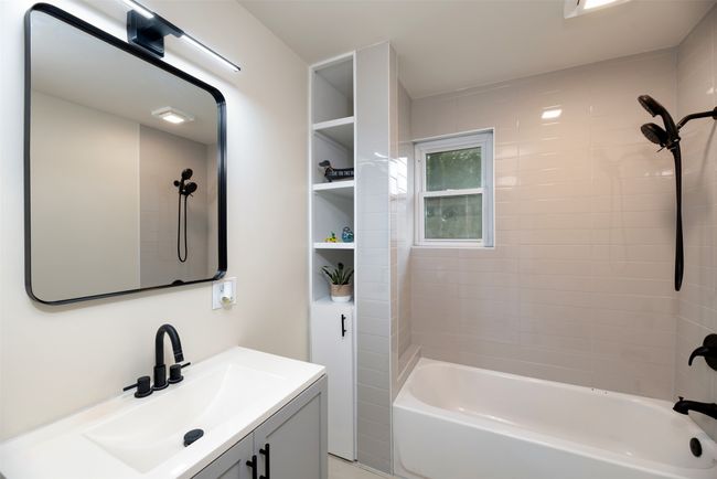 Full bath featuring vanity and shower / washtub combination | Image 20