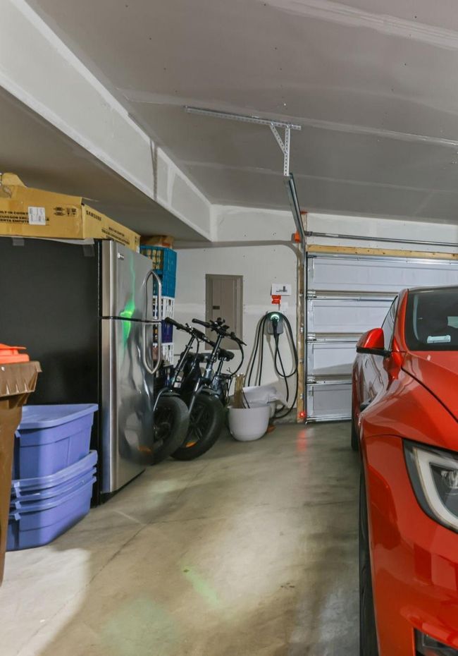 Spacious Garage has tons of extra storage space - enough for a fridge (which stays!). Note EV charger, extra outlets for fridge or other gadgets. | Image 37