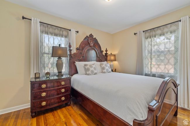 Bedroom featuring wood finished floors and baseboards | Image 12