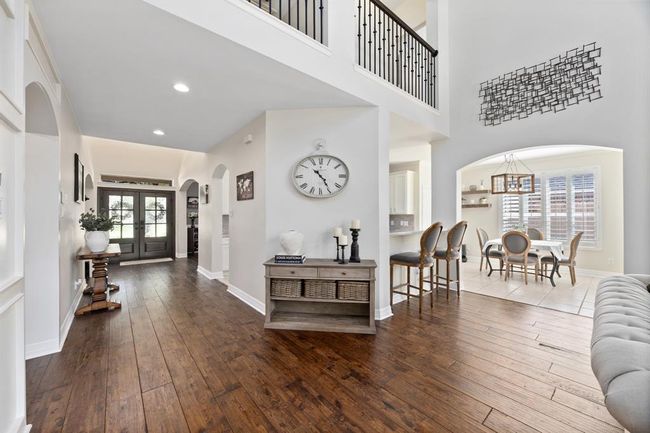 A look towards the double front doors and cat-walk across the second floor. | Image 12