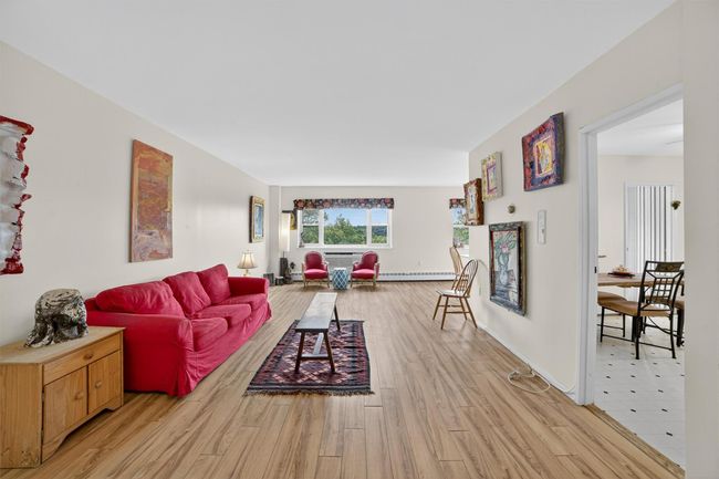 Living area featuring light wood-type flooring | Image 6