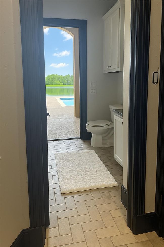 Guest bathroom with shower for outside pool access | Image 22