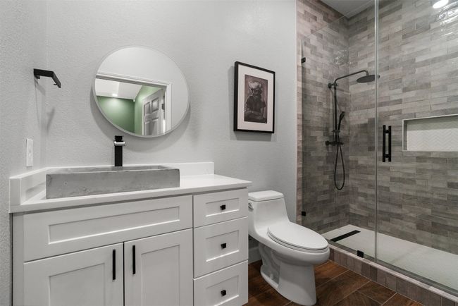 The updated bathrooms include sophisticated touches, like designer fixtures and stylish tile work, giving each one a spa-like ambiance that invites you to unwind and recharge | Image 23
