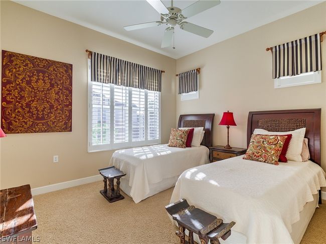 Carpeted bedroom featuring ceiling fan | Image 27
