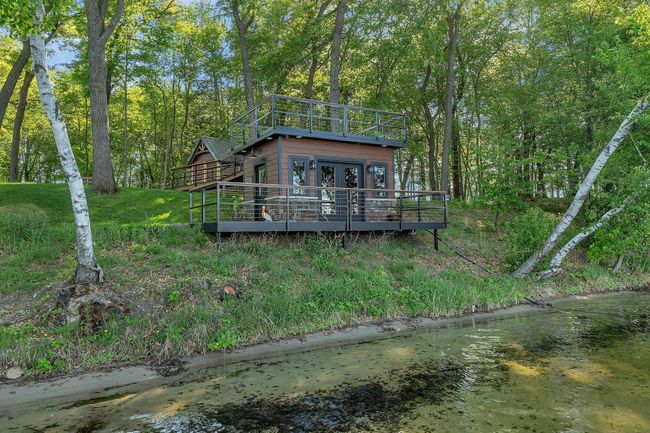 Fish house with a serving line, speakers and seating area. | Image 19