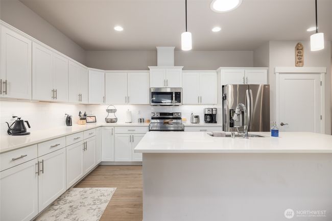 There is lots of counter space & an eating bar too. | Image 14