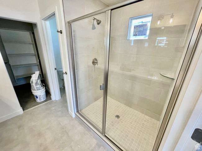Full bath featuring a stall shower and toilet | Image 13