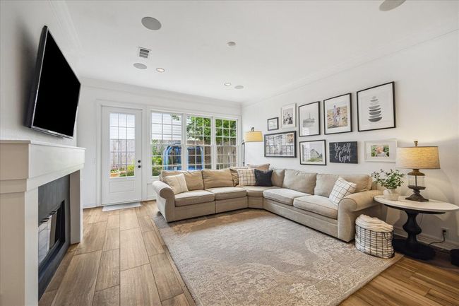 Family room has lots of natural light and overlooks the private back yard. In ceiling speakers for music or surround sound. | Image 13