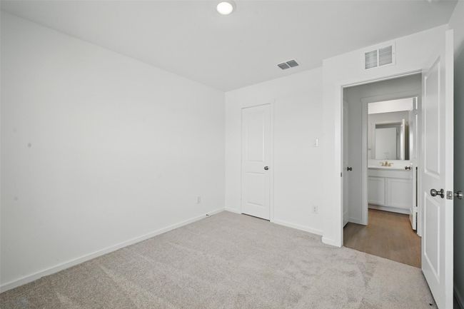 Unfurnished bedroom featuring carpet floors and baseboards | Image 14