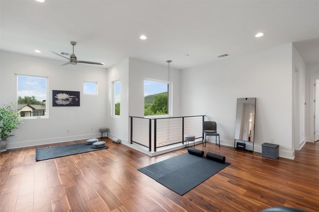 A versatile open space, perfect for a home gym, reading area, or craft studio. | Image 31