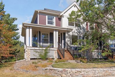 This end-unit townhome has a fabulous wrap around porch entry. | Image 1