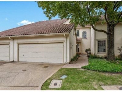 Mediterranean / spanish-style house featuring a garage | Image 1