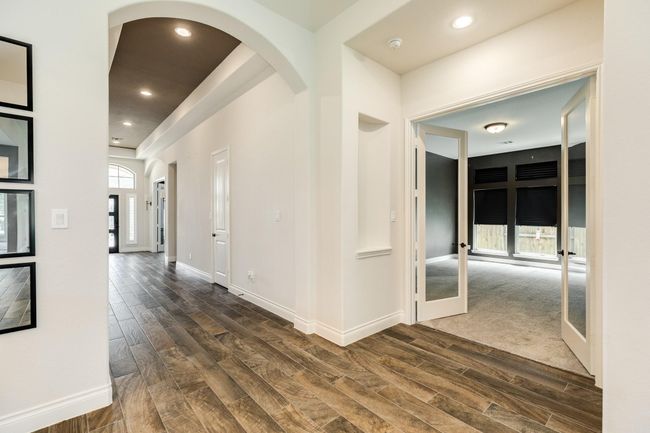 Double glass door entrance to media room can also be used as a flex room. | Image 12