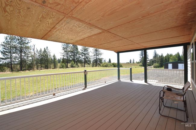 Wooden deck featuring a lawn | Image 24
