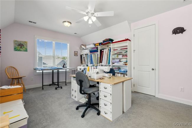 This room is currently used as a crafting room, and could also serve well as a media room or extra large bedroom. | Image 38