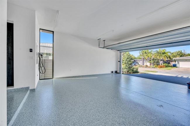 Spacious 24x20 Garage w/sleek epoxy-painted floor and ChargePoint EV charger | Image 59