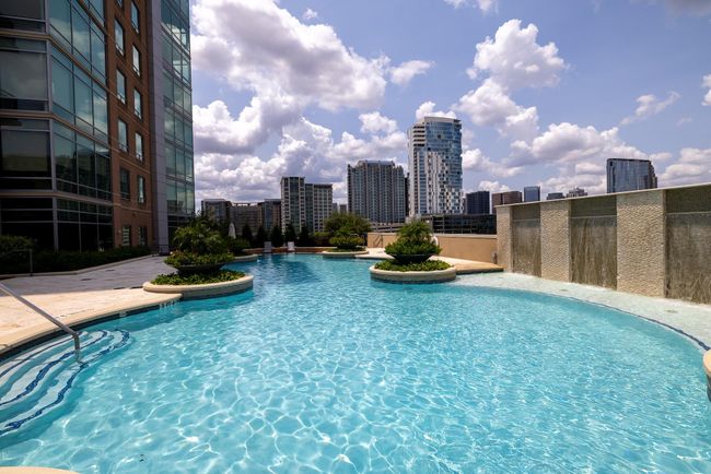 Stunning pool with city views, perfect for relaxation and entertainment. | Image 28