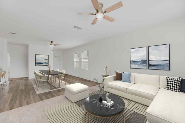 Enjoy cozy evenings in this inviting living space with easy access to the kitchen. *Virtually Staged* | Image 4