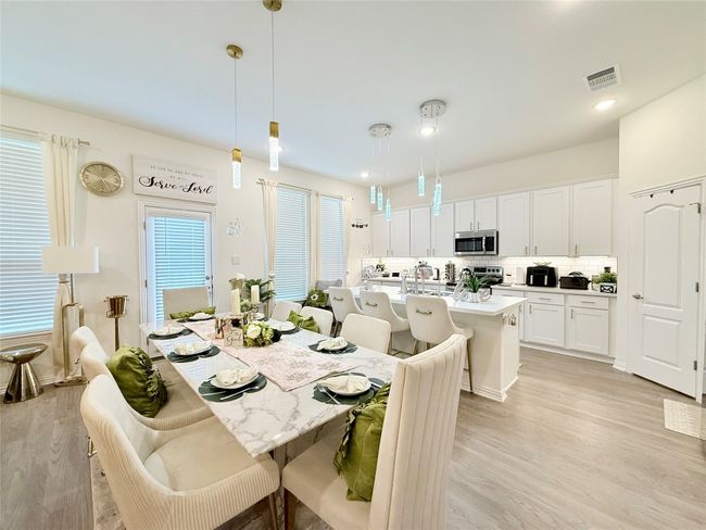 Dining space with light wood-type flooring and recessed lighting | Image 7