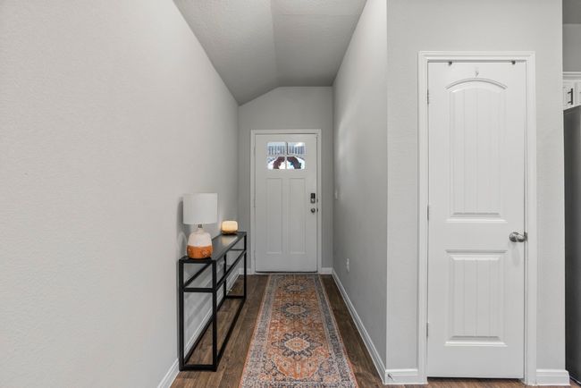 Doorway to outside with vaulted ceiling and dark wood-type flooring | Image 5