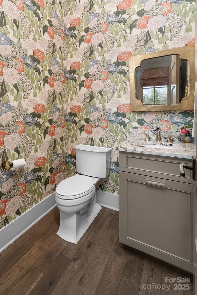 Charming powder room on the main level in private hallway. | Image 14