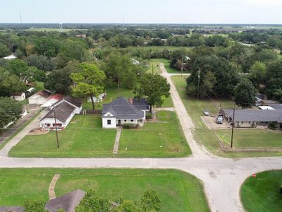 Situated on a desirable corner lot, there is plenty of room for dogs to roam, kids to play, and adults to tinker. | Image 2