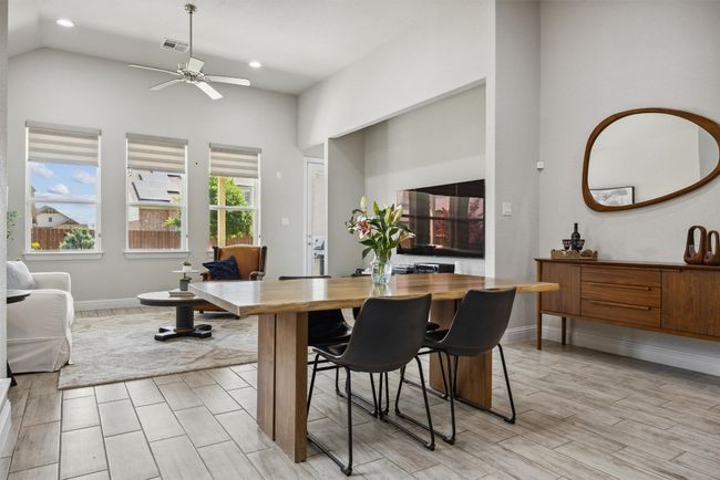 Dining space with ceiling fan, recessed lighting, and high vaulted ceiling | Image 10