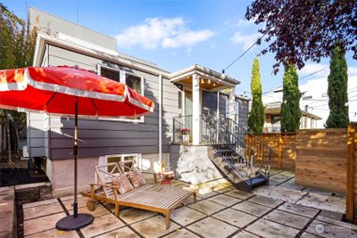 Large fully-fenced patio with garden space. Perfect for entertaining! | Image 1