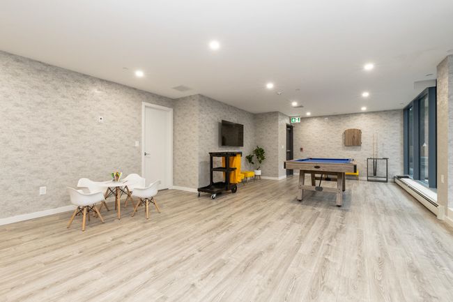 Recreation room featuring baseboard heating, pool table, recessed lighting, wood finished floors, and baseboards | Image 17