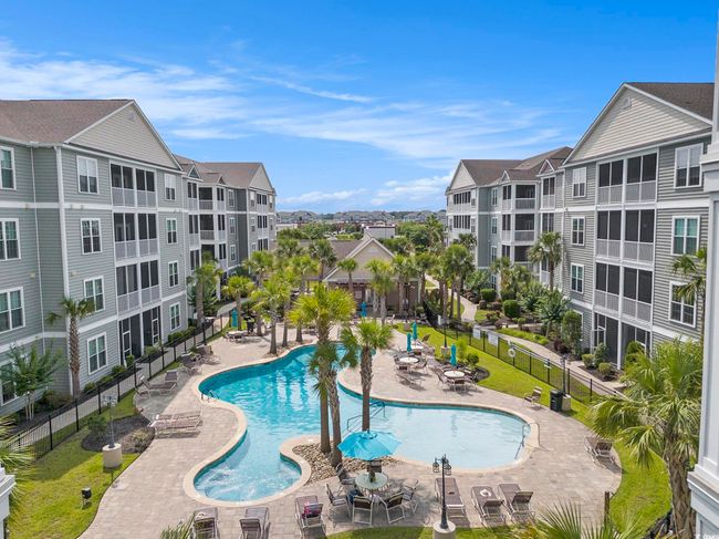 Community pool with a​​‌​​​​‌​​‌‌​‌‌​​​‌‌​​‌‌​‌​​​​​‌ patio | Image 4